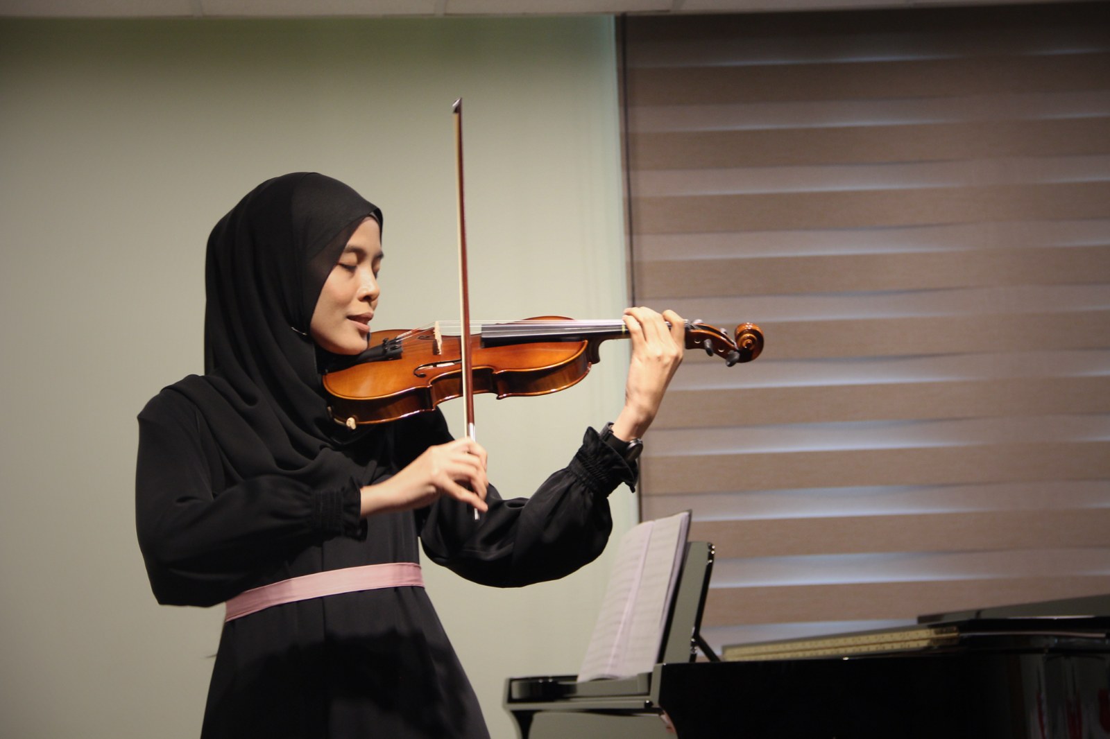 Violinist performing at the Cephas Music School Annual Concert