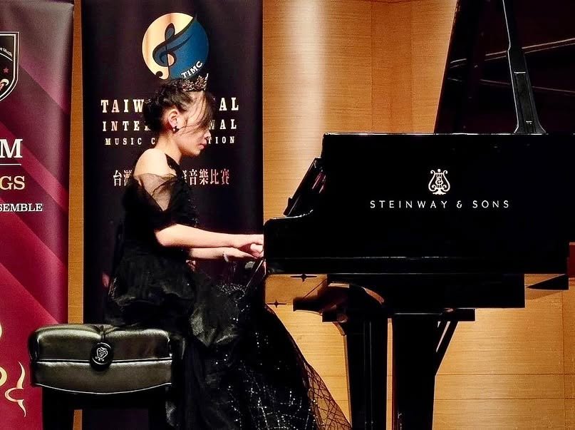 Cephas student performing on a Steinway grand piano at a competition