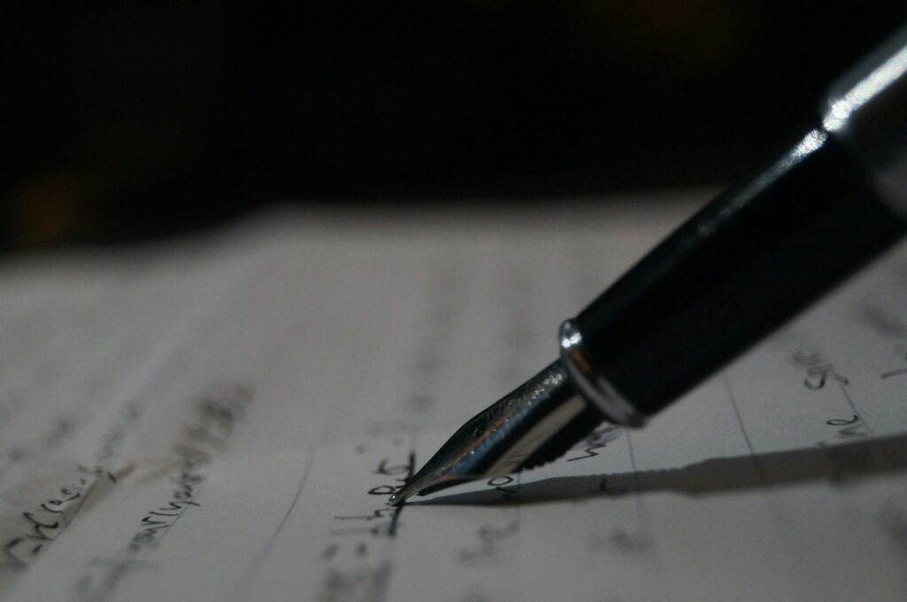 Fountain pen writing notes on a music manuscript