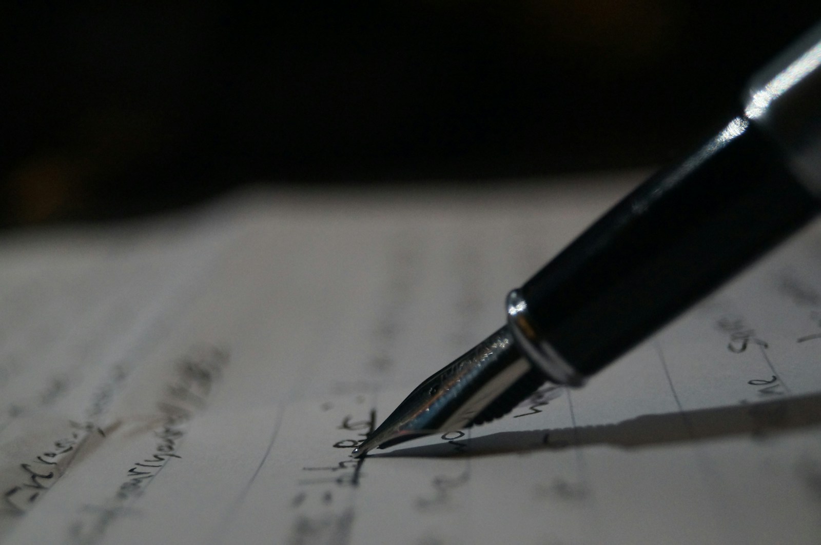 Pen writing music on a manuscript